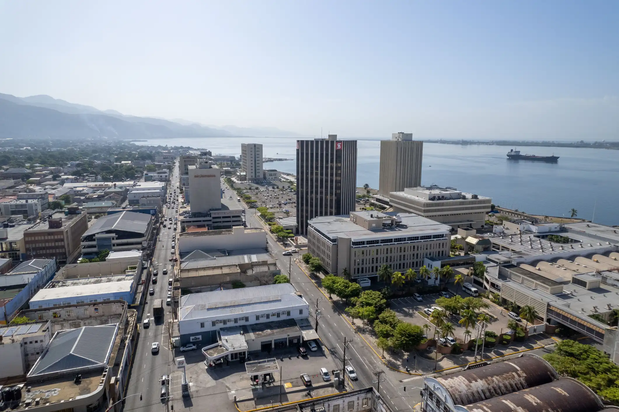 Aerial view of coastal buildings in downtown Kingston under the blue skyline